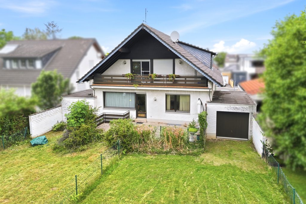 Gütelhöfer Immobilien - Immobilienangebot - Euskirchen / Flamersheim - Alle - Vermietetes Zweifamilienhaus mit Entwicklungspotenzial, 2 Garagen und großem Garten in Flamersheim